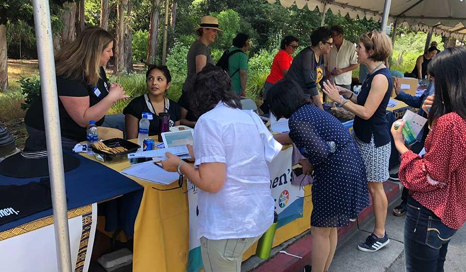 Cal Women's Network table at an outreach event